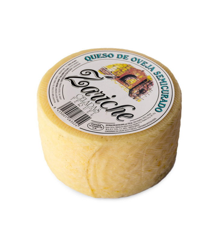 Queso artesano de oveja de Teruel, con una textura cremosa y sabor intenso, curado durante 60 días.